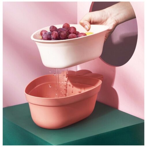 Colador con forma de zanahoria rosa